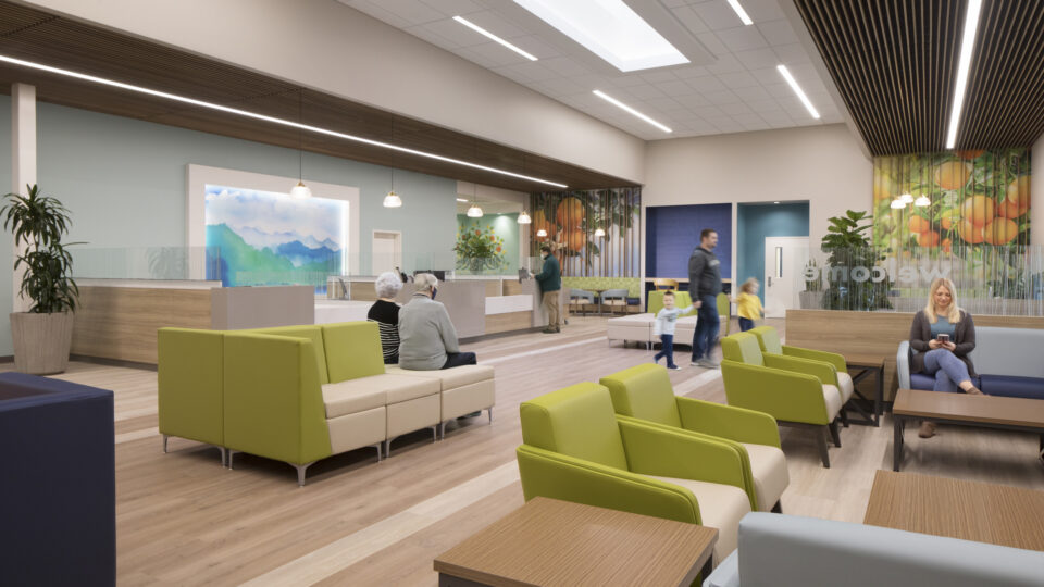Modern clinic waiting room with green chairs, reception desks, and several adults and children seated or walking.