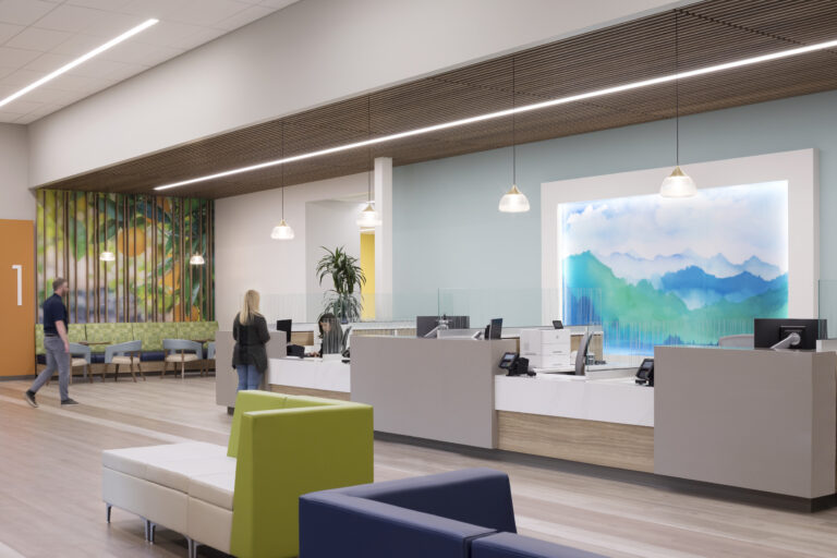 Modern reception area with service desks, colorful seating, pendant lights, and a large blue-green wall mural.